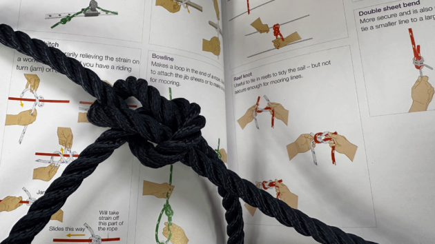 Rope tying with RYA handbook behind.