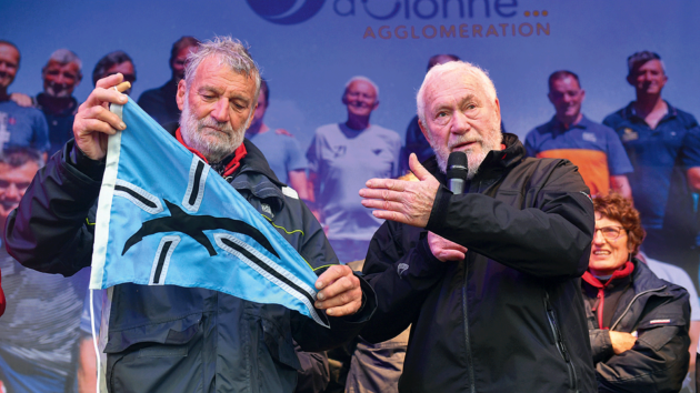 Van Den Heede (l) steps ashore after winning the GGR.